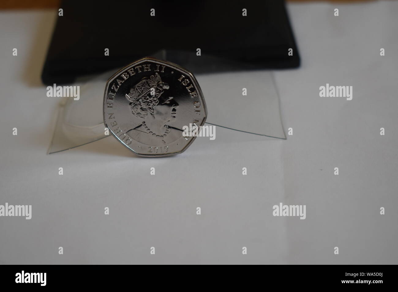 Brand new reverse side of the 2019 release by the Mint, of the new Peter Pan Fifty Pence. Queens head Set against a black and transparent background. Stock Photo