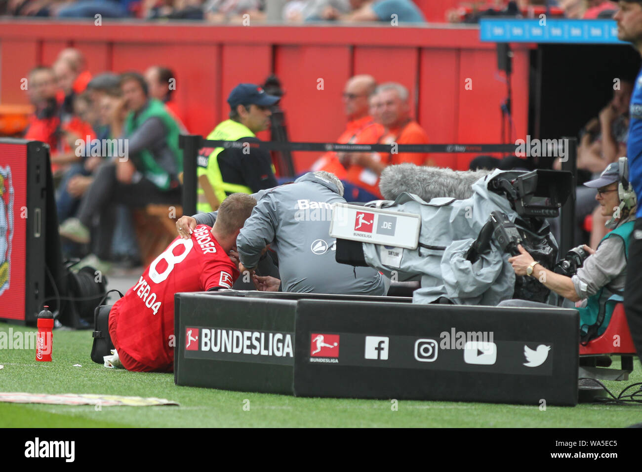 Leverkusen's Lars Bender being treated with a bloody nose during the Bundesliga match between Bayer 04 Leverkusen and SC Paderborn at BayArena.(Final Score: Bayer 3 - 2 Paderbon) Stock Photo
