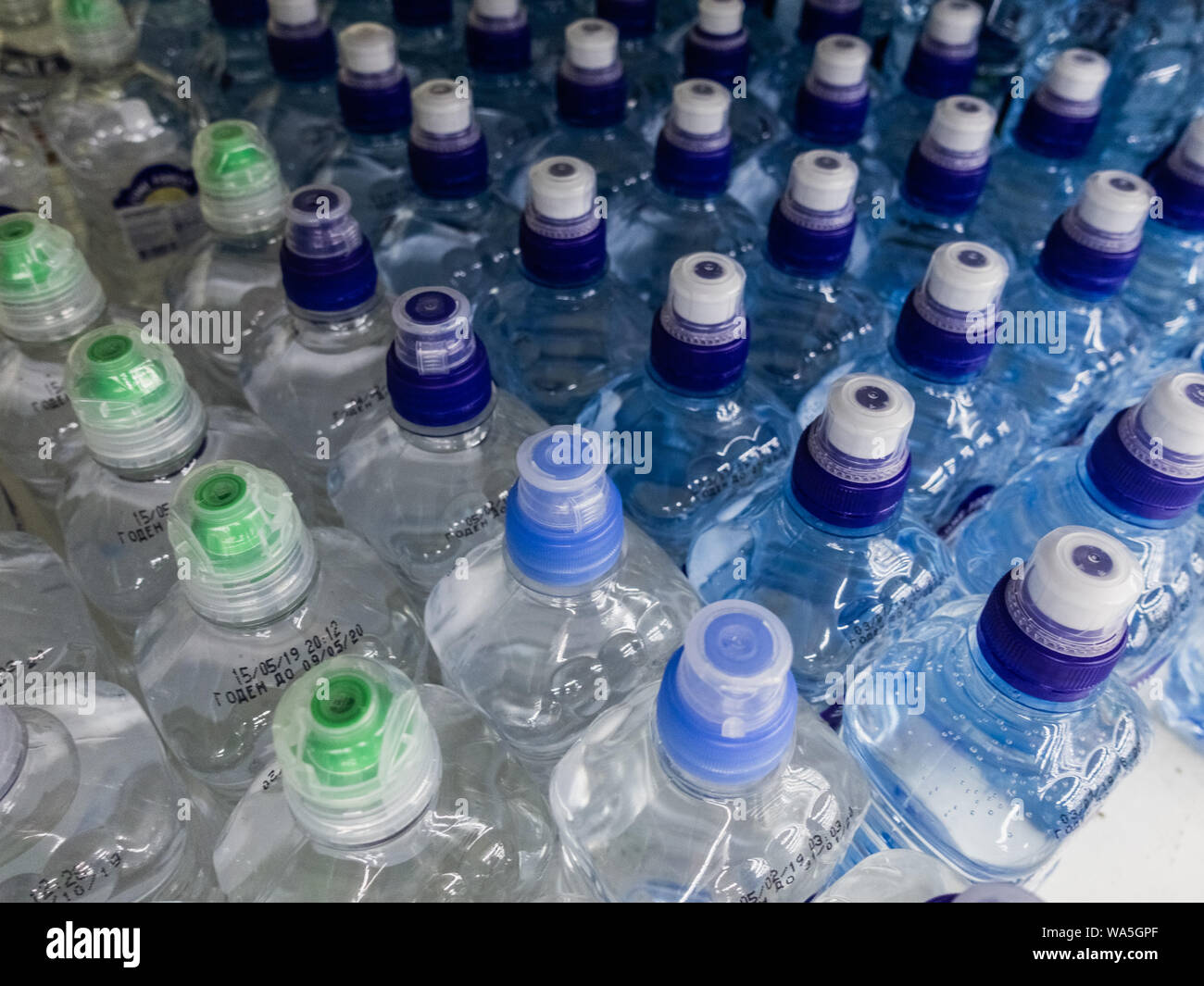 Plastic bottles with wate. Rows of waterfilled plastic bottles with