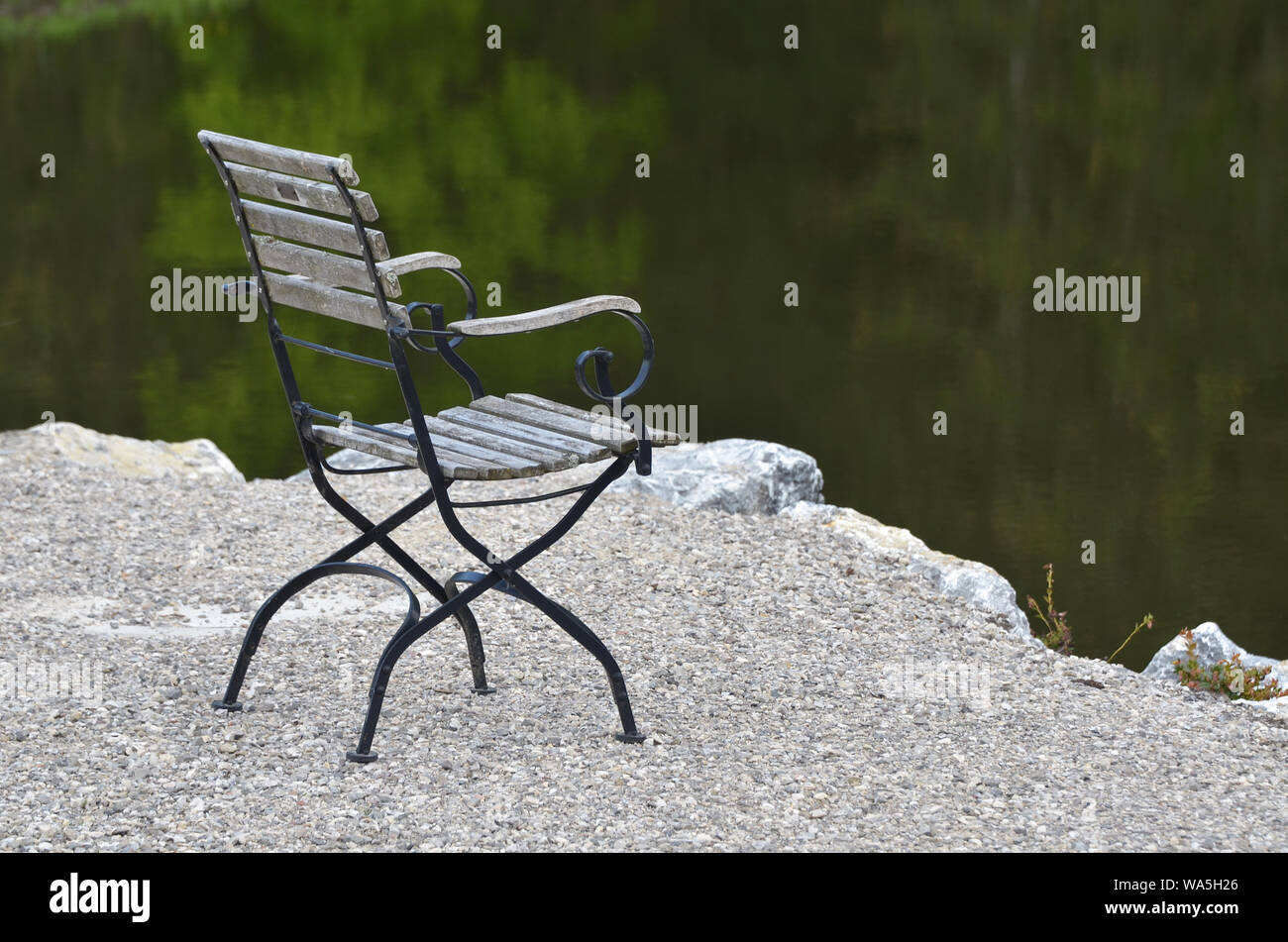 lonely chair at lake Stock Photo