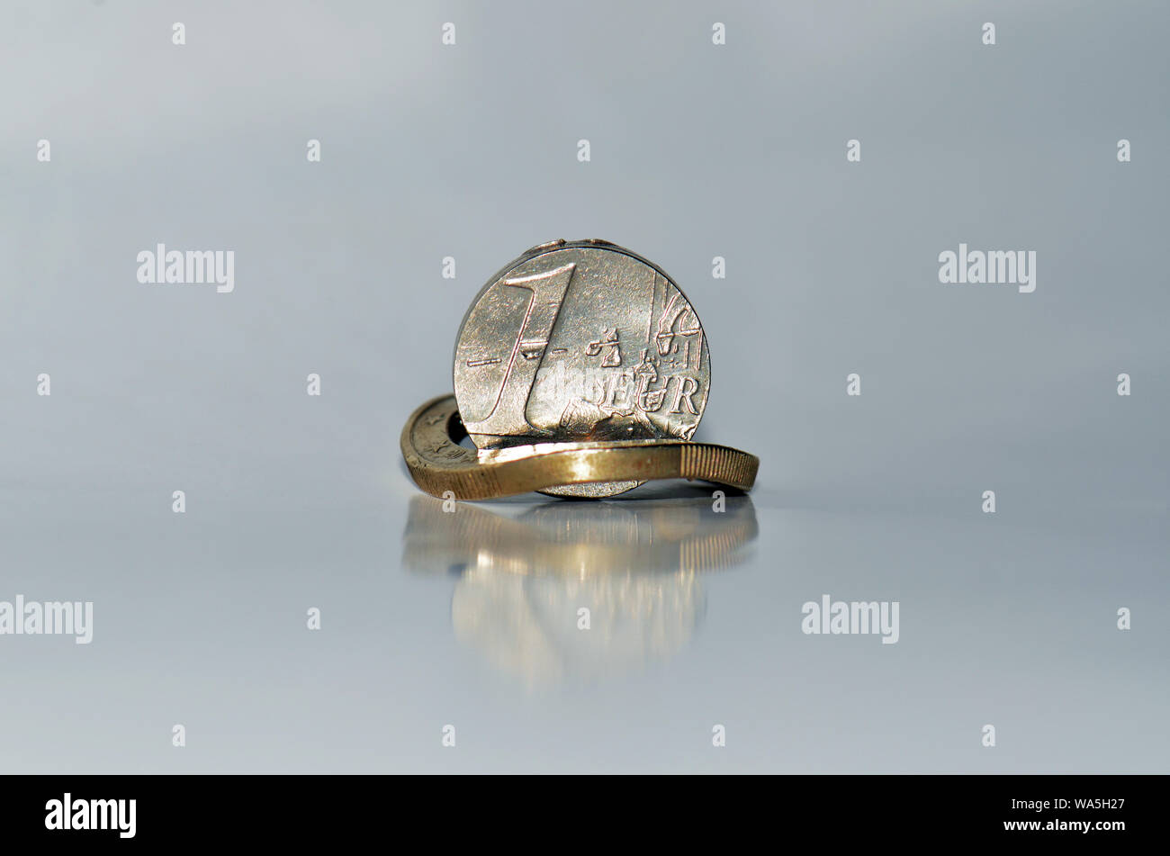 demaged Euro from Eurozone in two pieces Stock Photo
