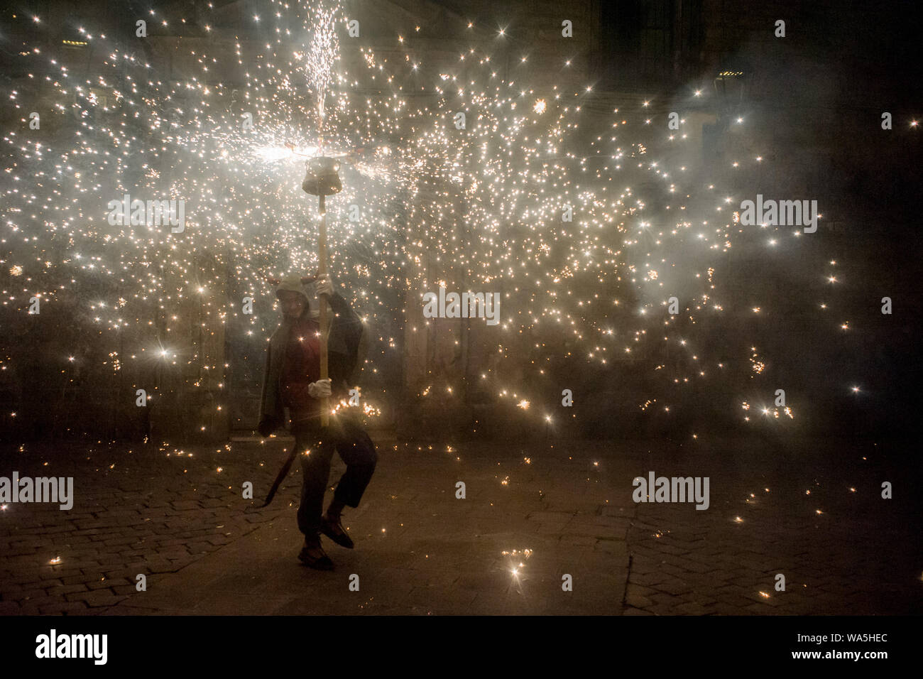 A devil takes part in a correfoc during the celebration of Sant Roc ...
