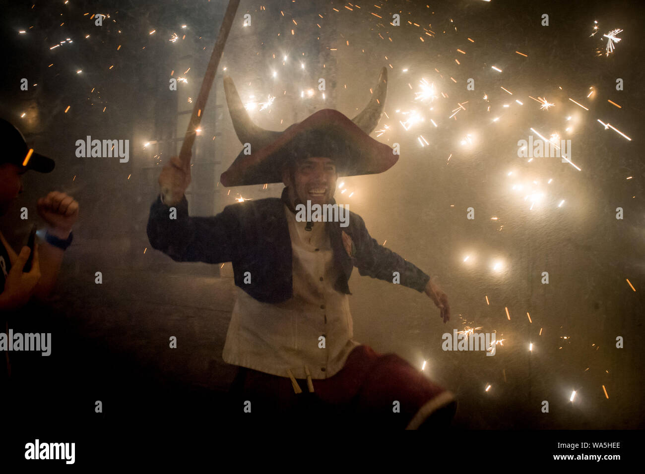 A devil takes part in a correfoc during the celebration of Sant Roc ...