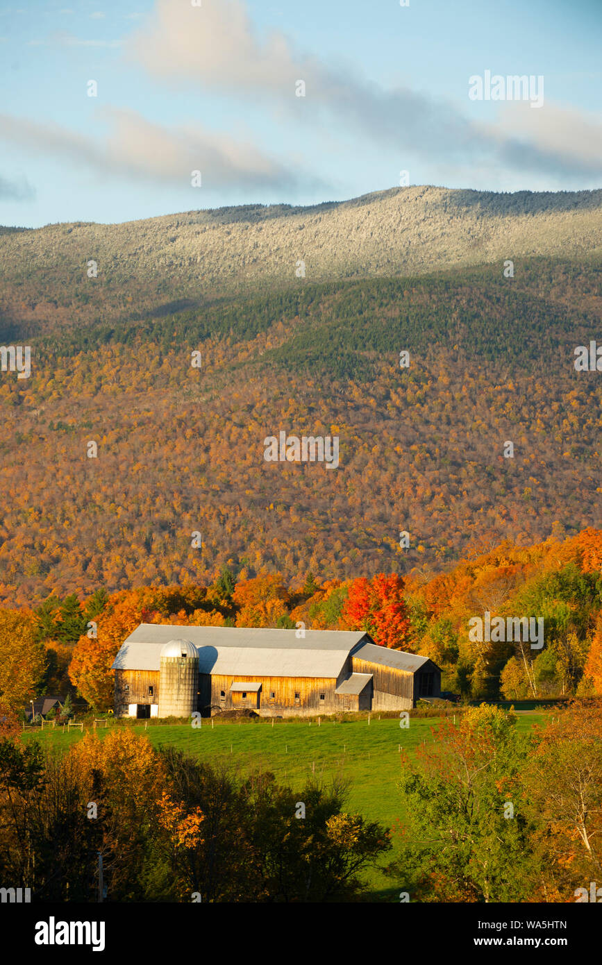 The Bragg Farm sits on a hill in Fayston, Vermont during peak foliage