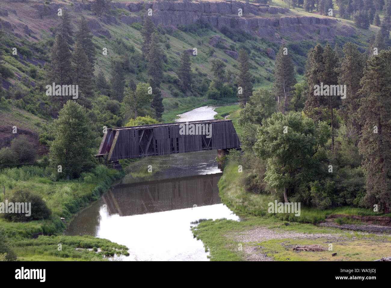 An old Railroad Bridge has fallen into a state of disrepair Stock Photo