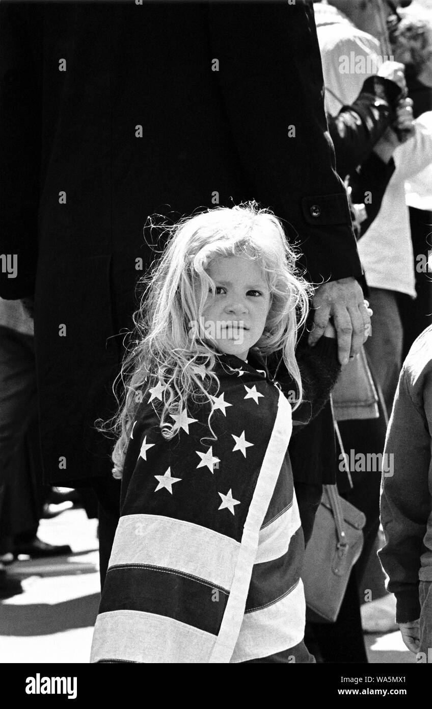 Young girl wrapped in American flag, San Franciso peace march, 1967 Stock Photo