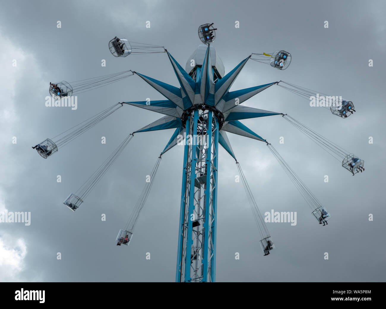 Tourists enjoying a spin high in the sky with one of London's latest attractions, a flying swing on the Southbank. Stock Photo