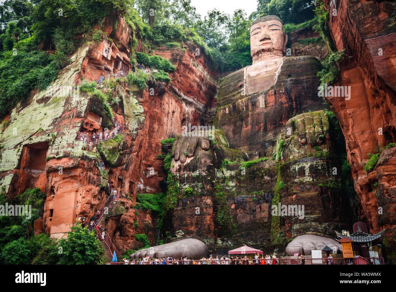 Full view of the Leshan Giant Buddha or Dafo from river boat in Leshan Sichuan China Stock Photo