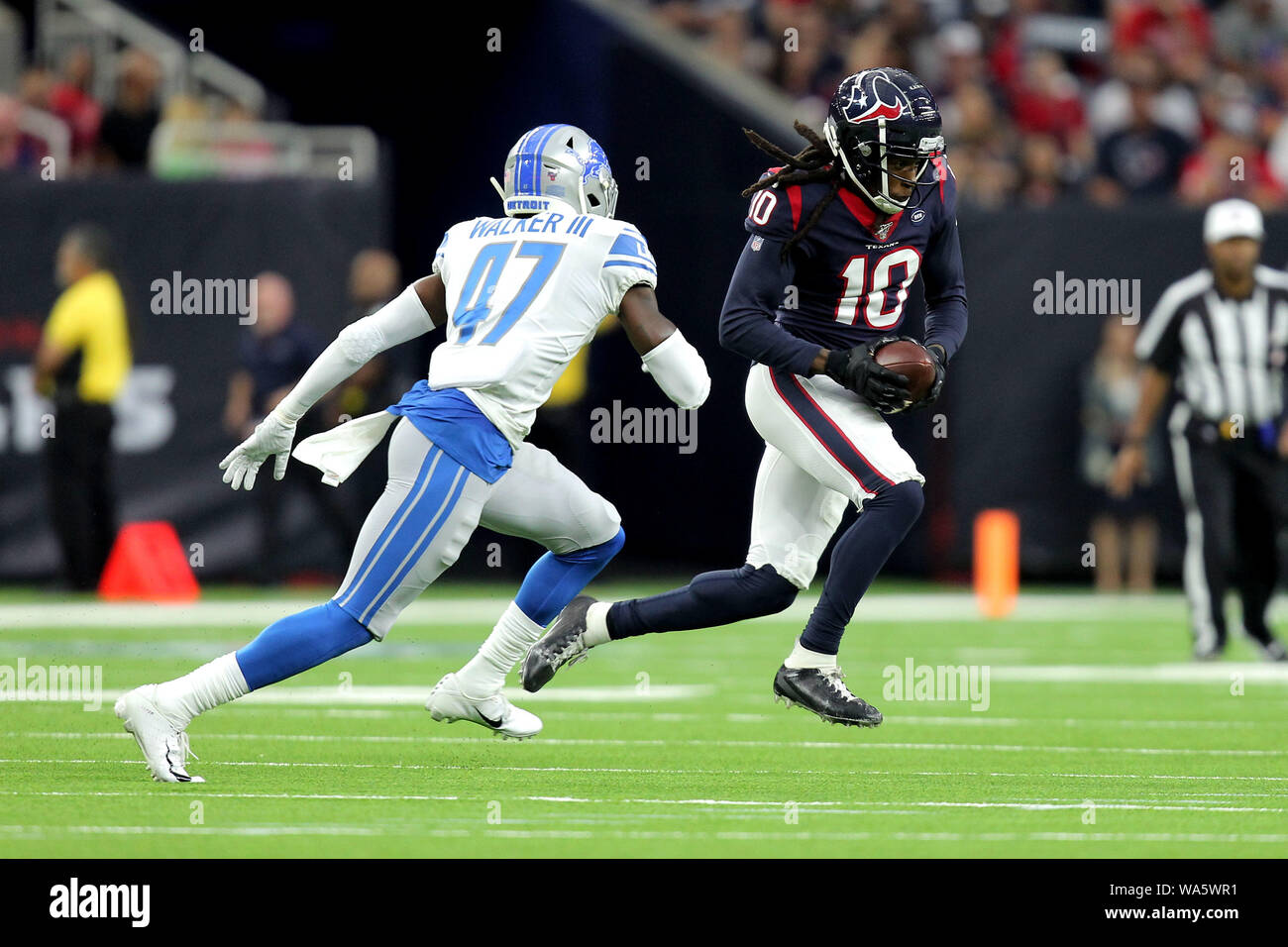 Houston, Texas, USA. 17th Aug, 2019. Houston Texans wide receiver DeAndre Hopkins (10, right) carries the ball after a pass reception while Detroit Lions defensive back Tracy Walker (47) pursues during the first quarter of the NFL preseason game between the Houston Texans and the Detroit Lions at NRG Stadium in Houston, TX on August 17, 2019. Credit: Erik Williams/ZUMA Wire/Alamy Live News Stock Photo