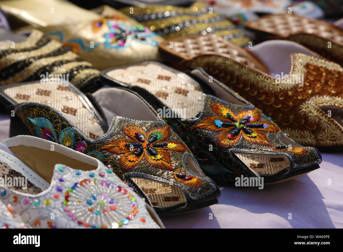 Juttis for sale at Surajkund Crafts Mela, Surajkund, Faridabad, Haryana, India Stock Photo