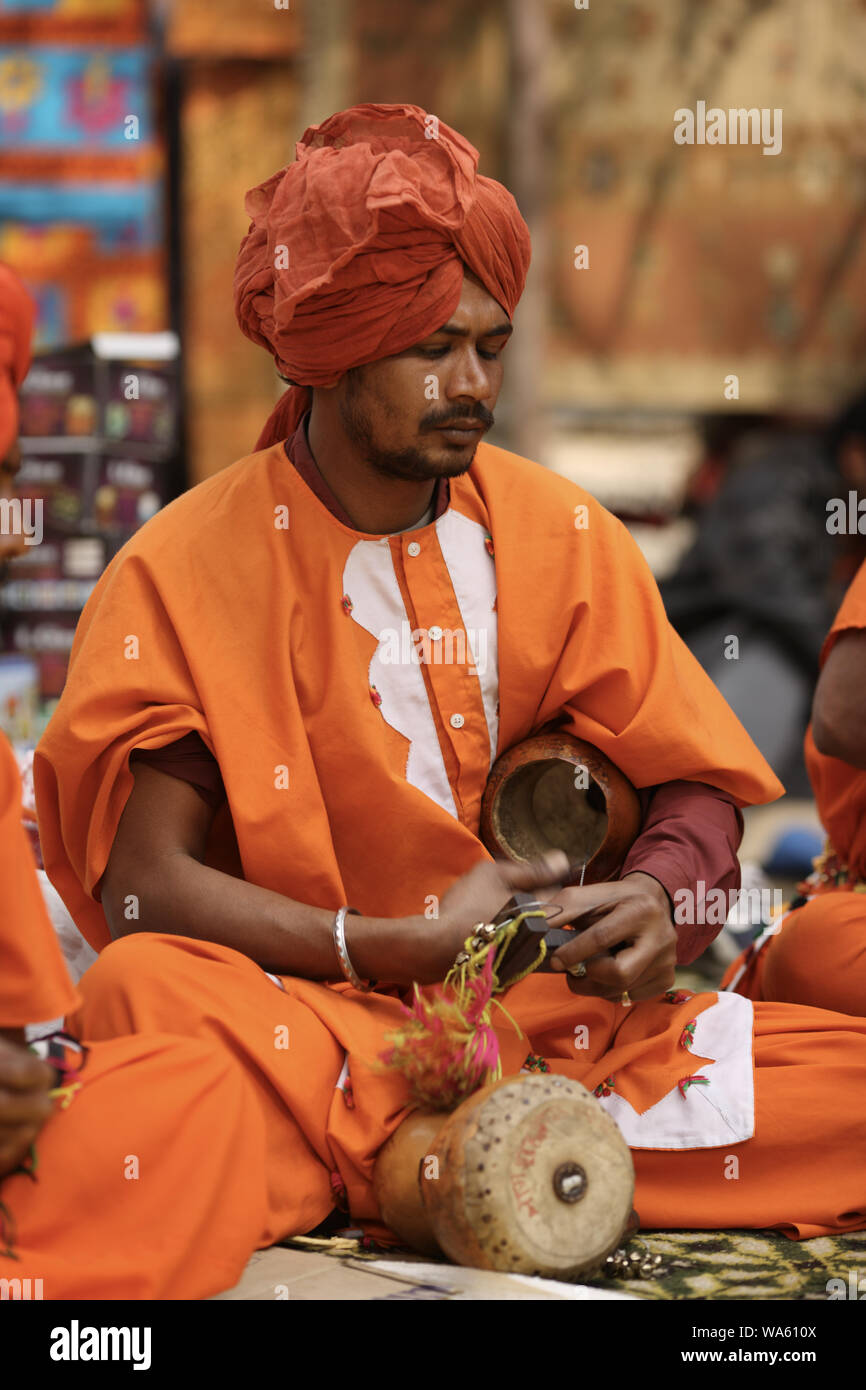 Man playing tambura at Surajkund Crafts Mela, Surajkund, Faridabad, Haryana, India Stock Photo