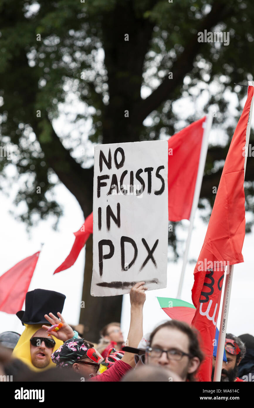 Members of the Popmob organization stage “The Spectacle” to counterprotest the “End Domestic Terrorism” rally at Tom McCall Waterfront Park on August 17, 2019 in Portland, Oregon. Organized as a protest against anti-fascists by right-wing radio host Joe Biggs and members of the Proud Boys, the rally attracted a large contingent of counterprotesters including Rose City Antifa. PopMob (Popular Mobilization) is a local group of activists with a goal of inspiring people to resist the alt-right through art, self-expression and performance. Stock Photo