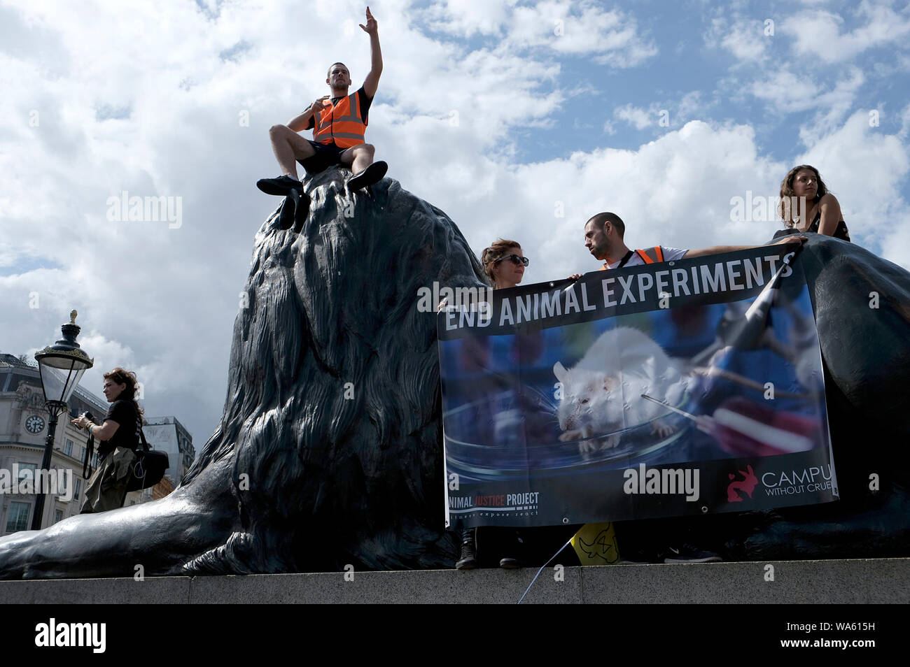 Activists hold a banner saying End animal experiments during the ...