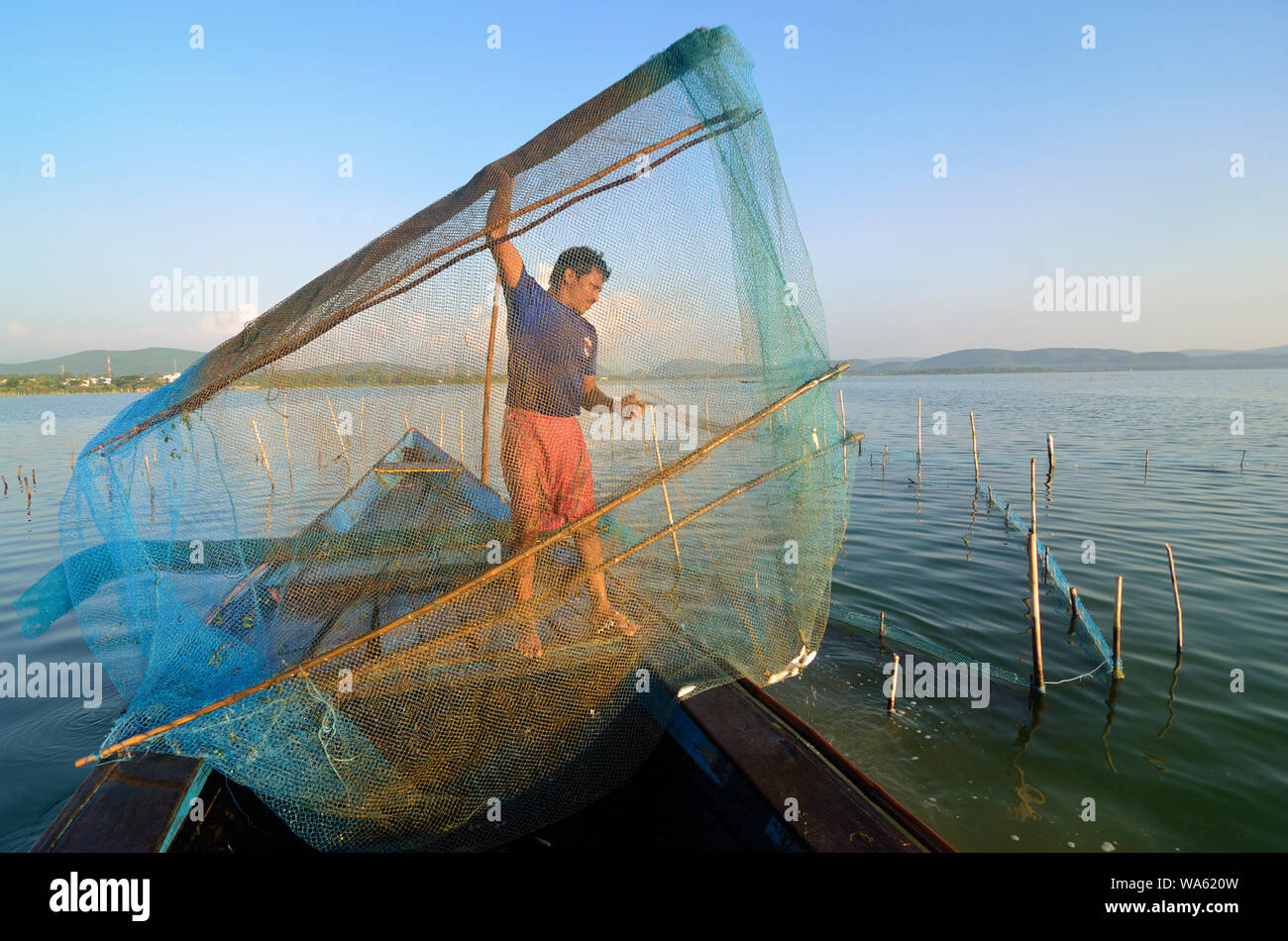 chilika fish net fishing net at chilika lake rambha odisha Stock Photo
