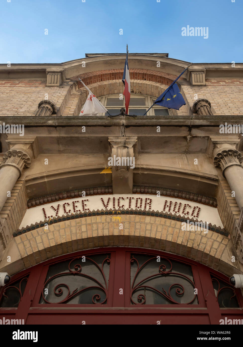 PARIS, FRANCE -AUGUST 02, 2018: Ornate signs over the entrance to Lycee Victor Hugo school in Rue de Sevigne Stock Photo