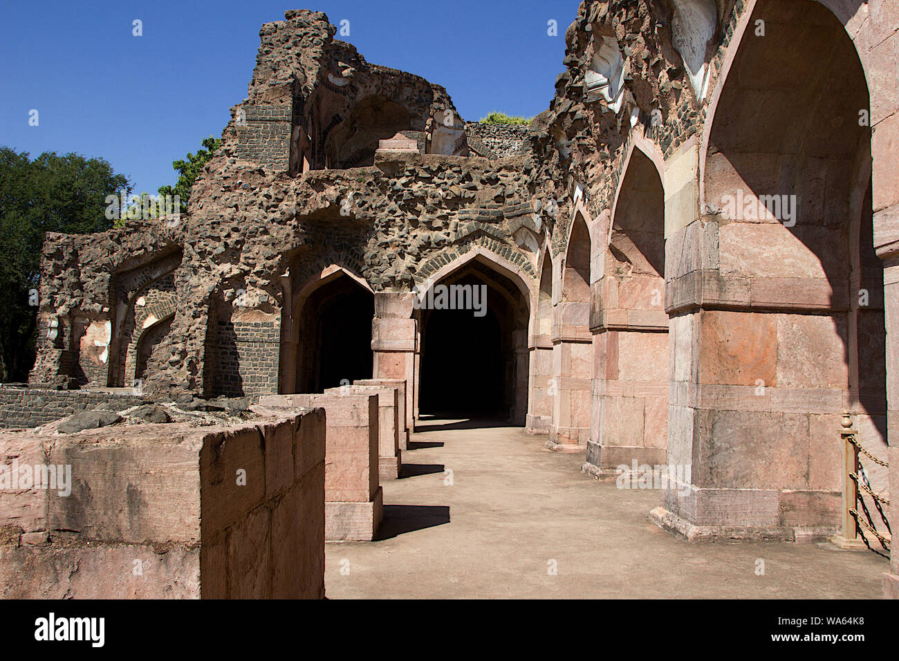 View of wrecked stone structure in the vicinity of Hindola Mahal or Swinging Palace at Mandu in Madhya Pradesh, India, Asia Stock Photo