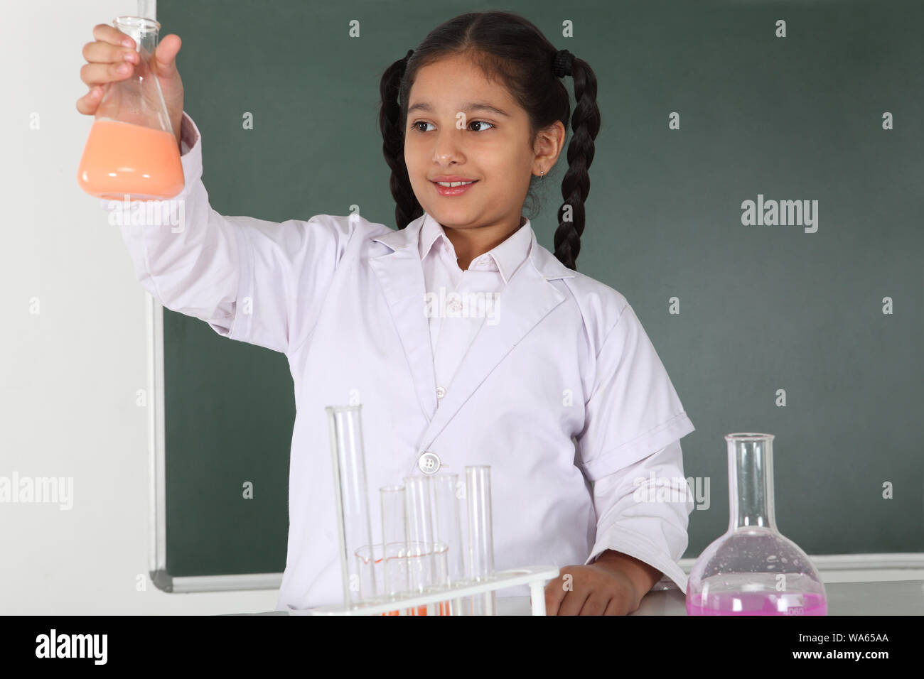 Schoolgirl experimenting in a chemistry lab Stock Photo - Alamy