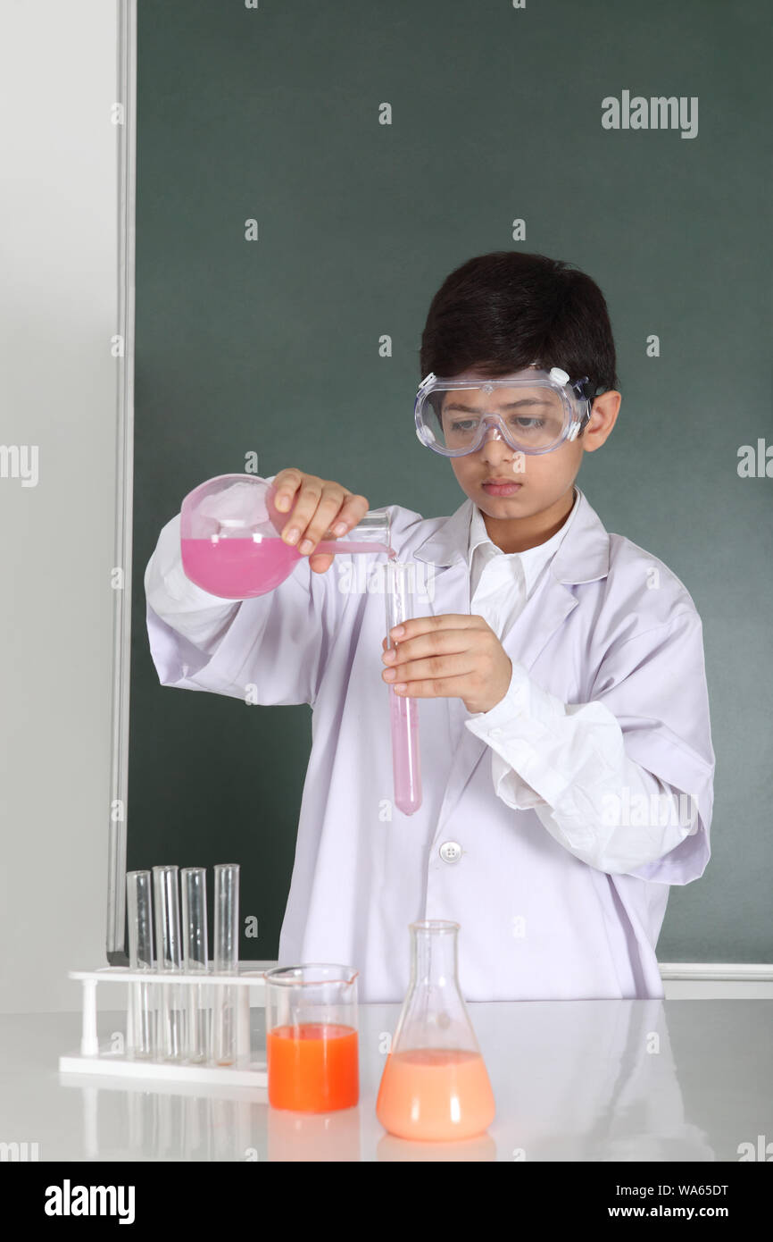 Schoolboy experimenting in a chemistry lab Stock Photo - Alamy