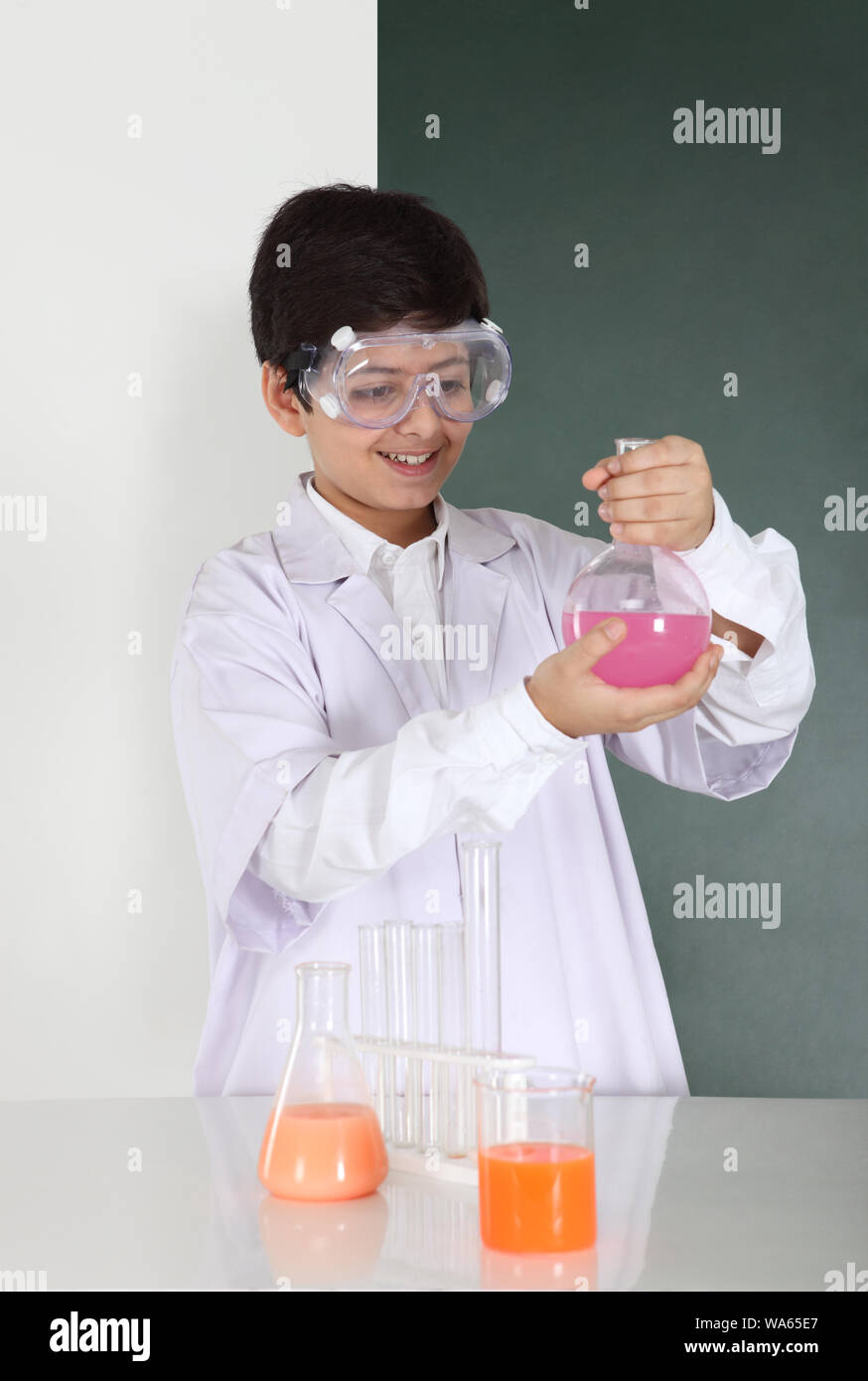 Schoolboy experimenting in a chemistry lab Stock Photo - Alamy