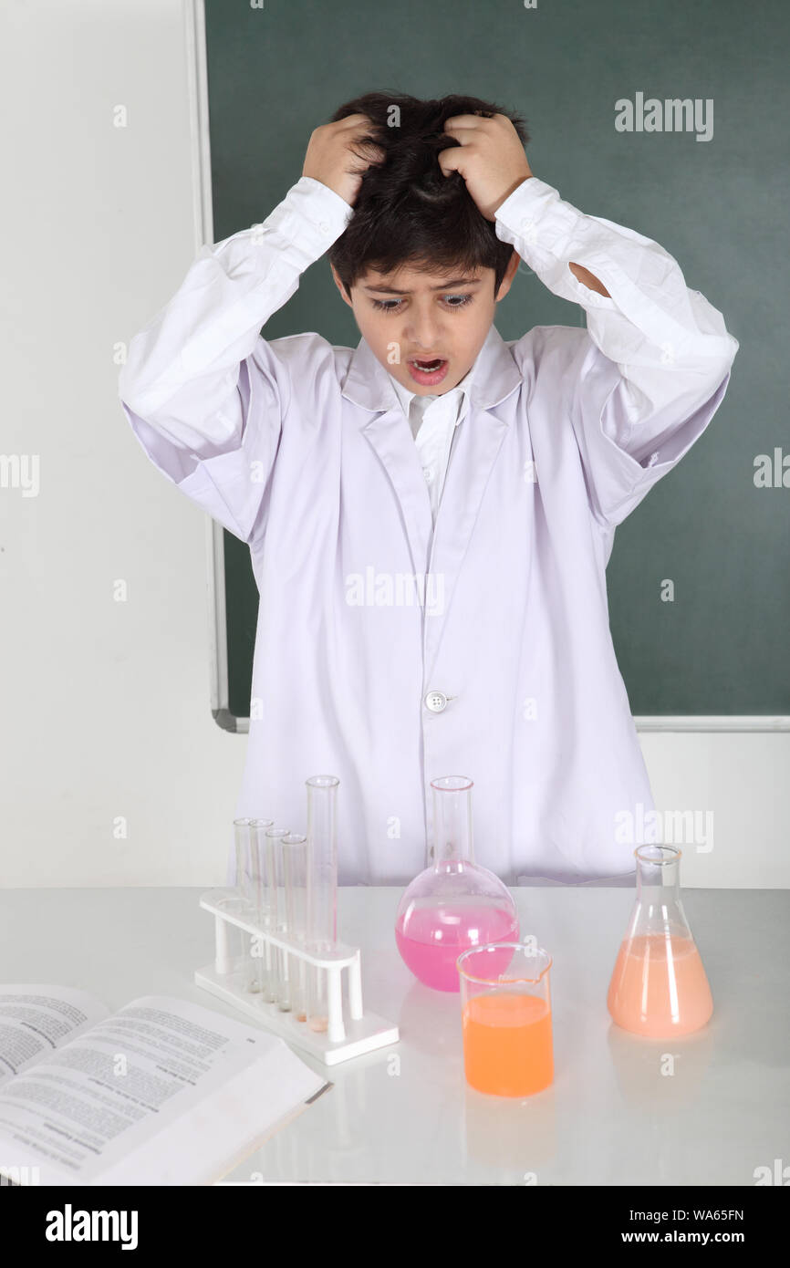 Schoolboy experimenting in a chemistry lab Stock Photo - Alamy