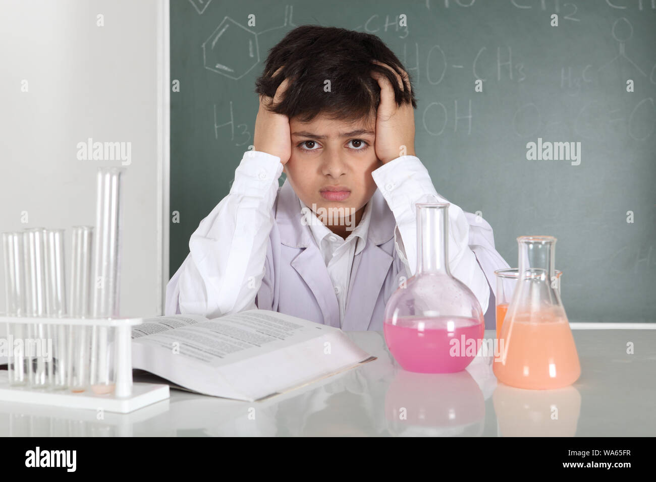 Schoolboy experimenting in a chemistry lab Stock Photo - Alamy