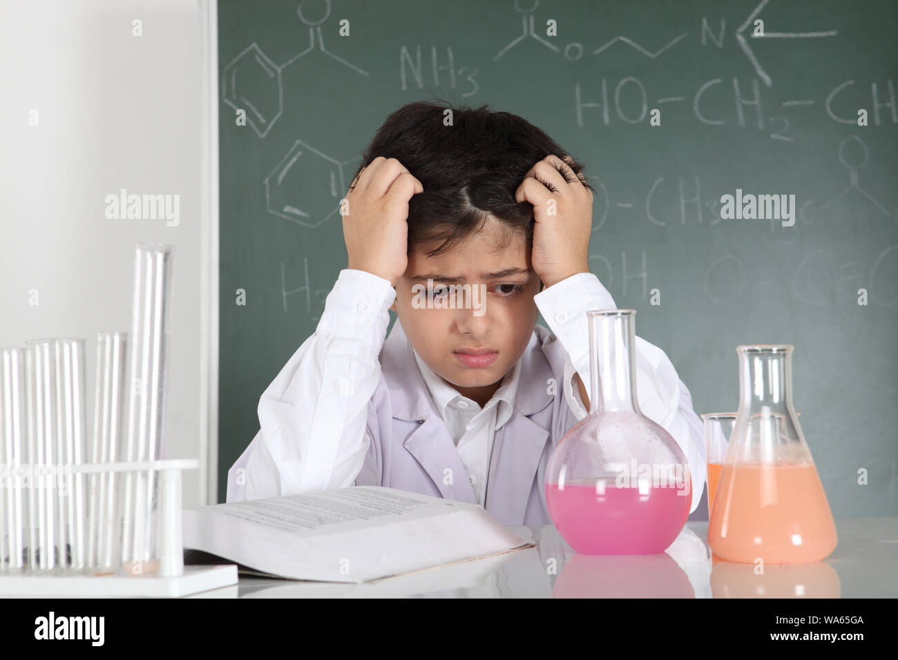 Schoolboy experimenting in a chemistry lab Stock Photo - Alamy