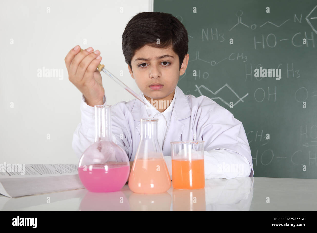 Schoolboy experimenting in a chemistry lab Stock Photo - Alamy