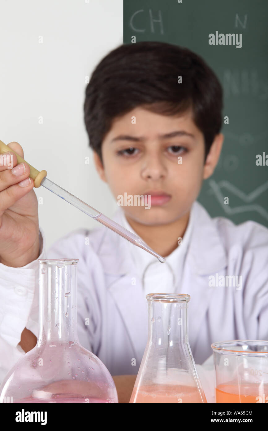 Schoolboy experimenting in a chemistry lab Stock Photo - Alamy