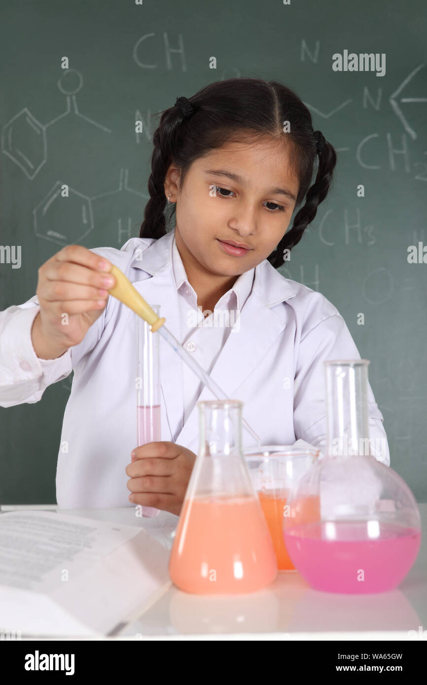Schoolgirl experimenting in a chemistry lab Stock Photo Alamy