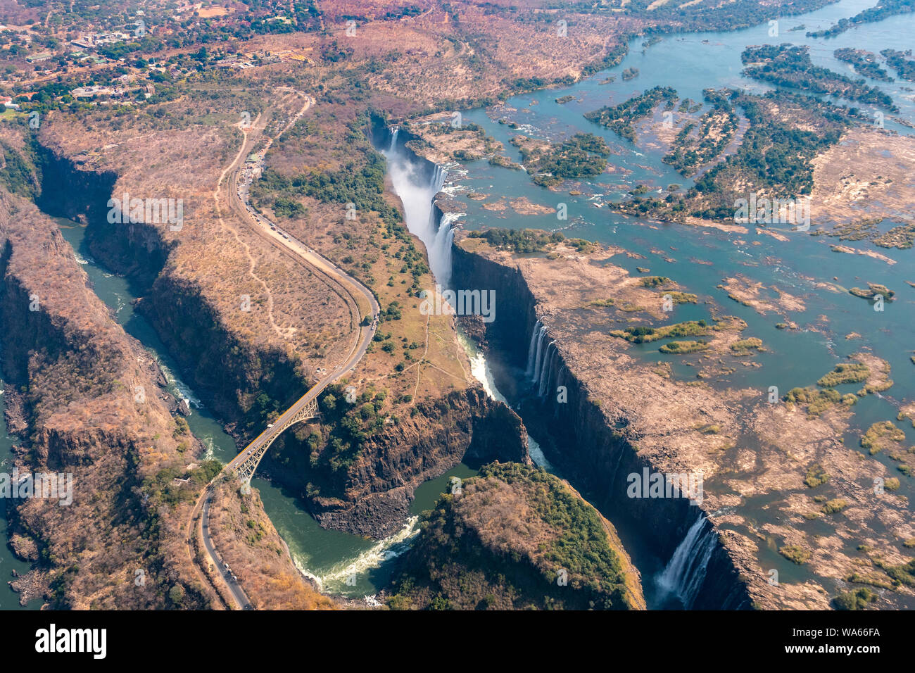 Spectacular Aerial of Victoria Falls Waterfall and Bridge across the Zambezi, Zimbabwe, Africa Stock Photo