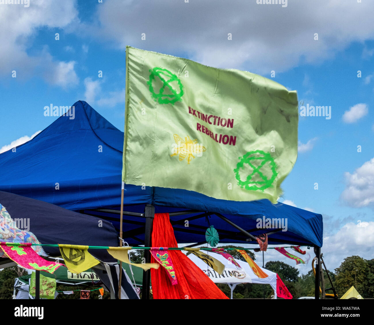 UK, London, Blackheath Common, 17-18th August 2019. An Extinction Rebellion event in South East London this weekend raises awareness of increasing Global climate change. Activists have planned activities on Blackheath Common to protest council and government investment in the fossil fuel industry and its effects on life on land & in the oceans. The two-day festival has included discussions, speakers, live band and entertainment. A free food (with voluntary donation) stall is serving Vegan food to the crowd. On Sunday (18th August) there will be a “new black death procession,” where protesters Stock Photo