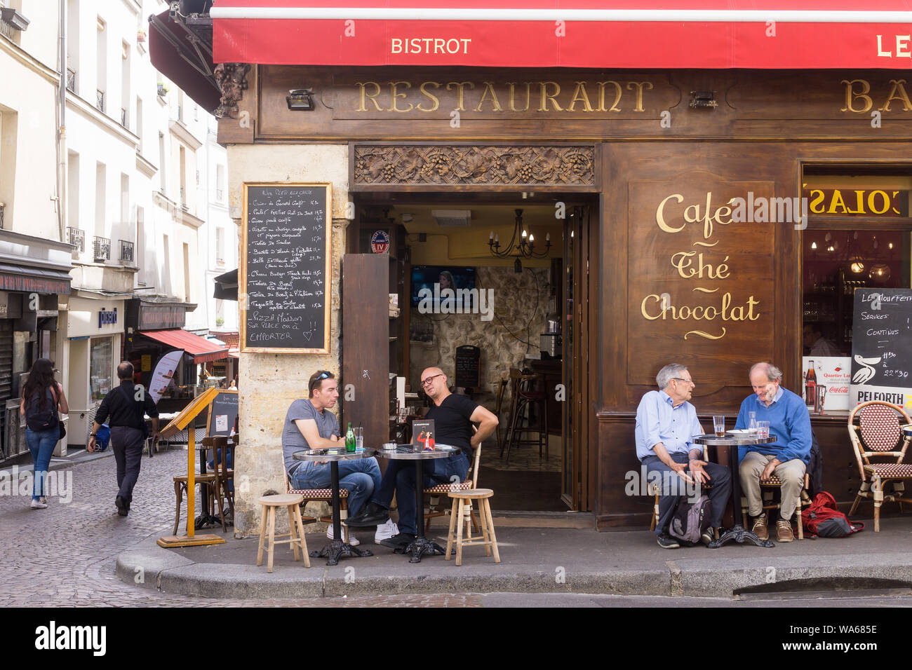 Paris bistro - Patrons enjoying afternoon drink at the bistro Le Café Mouffetard on Rue Mouffetard in the 5th arrondissement of Paris, France, Europe. Stock Photo