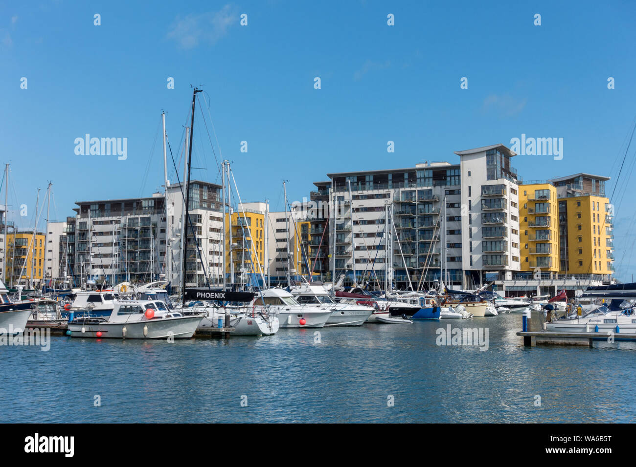 Luxury waterside apartments and boats, Sovereign Harbour, Eastbourne, East Sussex, England,UK Stock Photo