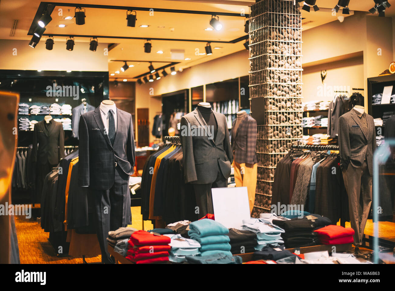 Male Business Style Clothing. Male Clothes On Mannequins And Hangers In Store Of Shopping Mall. Stock Photo