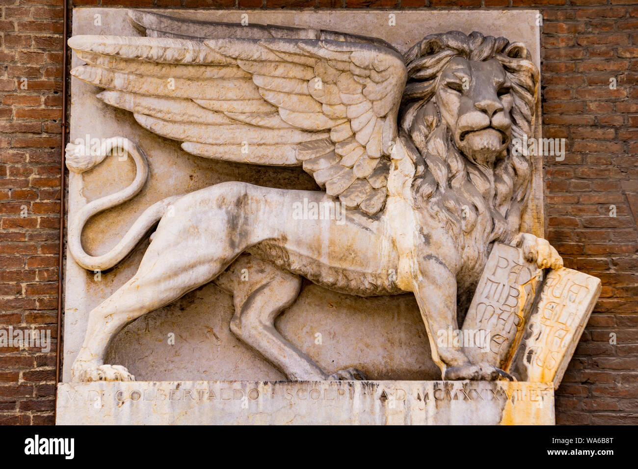 Venetian winged lion on the wall of old house at Piazza delle Erbe