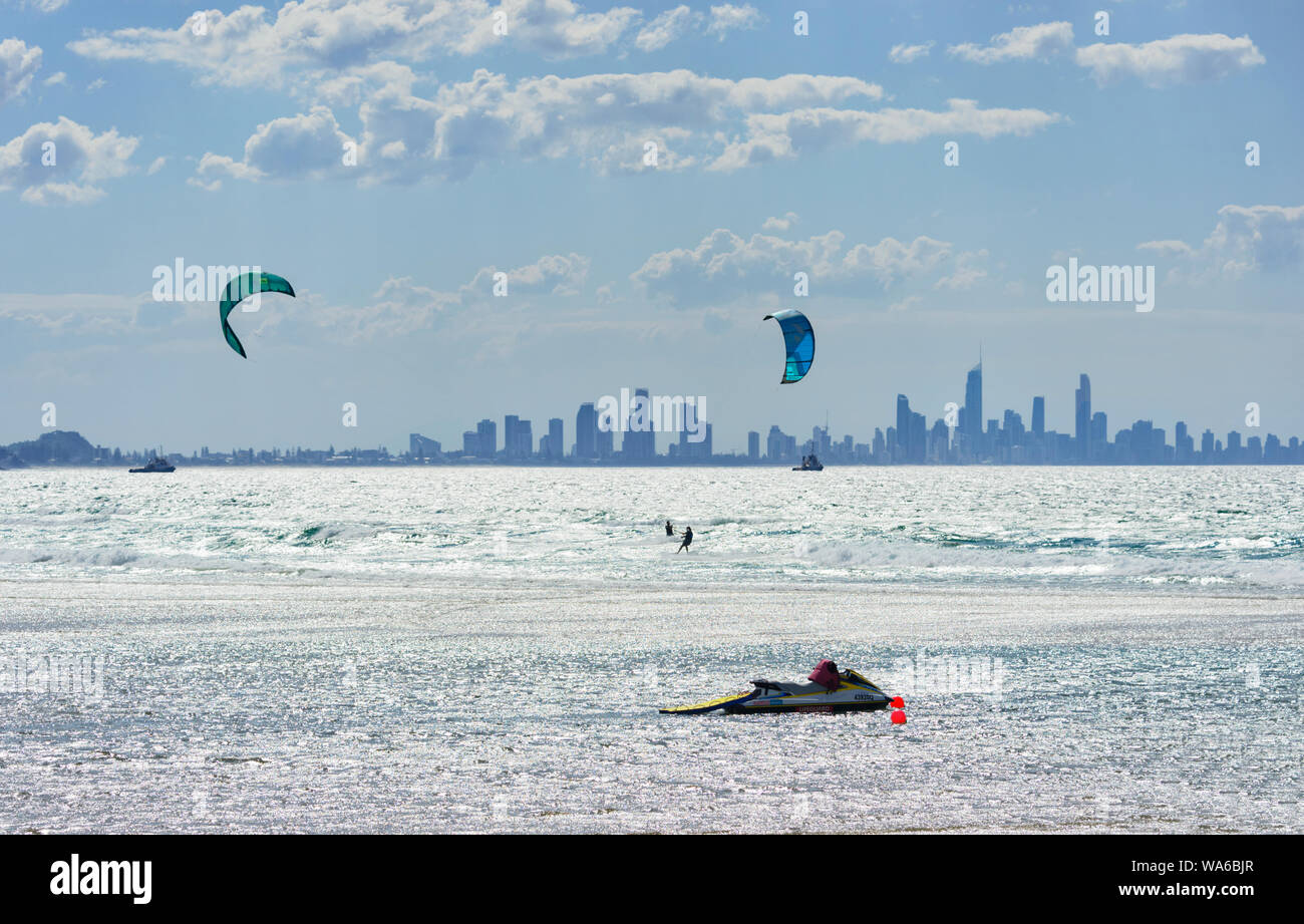 Kitesurfing at Currumbin Beach with a view of  Surfers Paradise skyline in the background, Gold Coast, Queensland, QLD, Australia Stock Photo