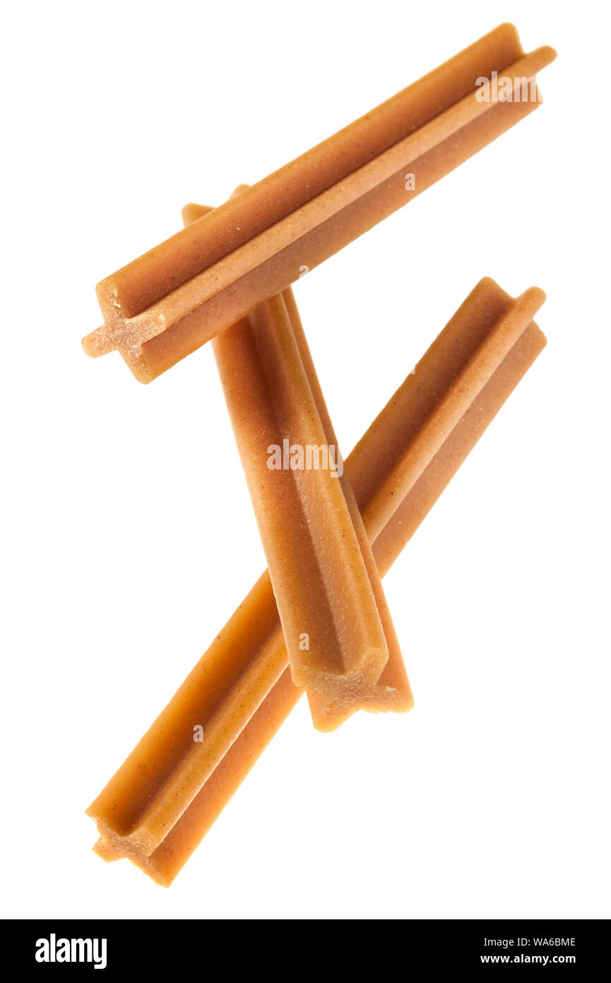 tendon sticks for gum massage in dogs isolated on white Stock Photo