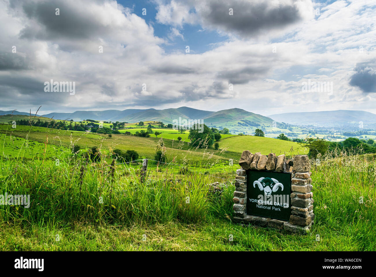 Yorkshire Dales National Park sign with mountains behind Stock Photo