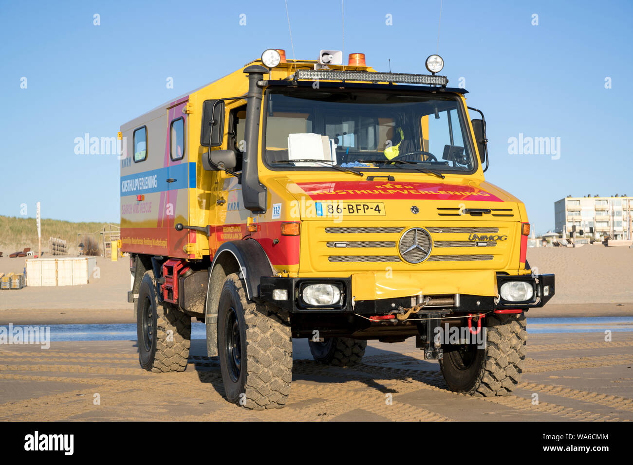 KNRM Mercedes-Benz Unimog on the beach. KNRM is the voluntary organization in the Netherlands tasked with saving lives at sea. Stock Photo