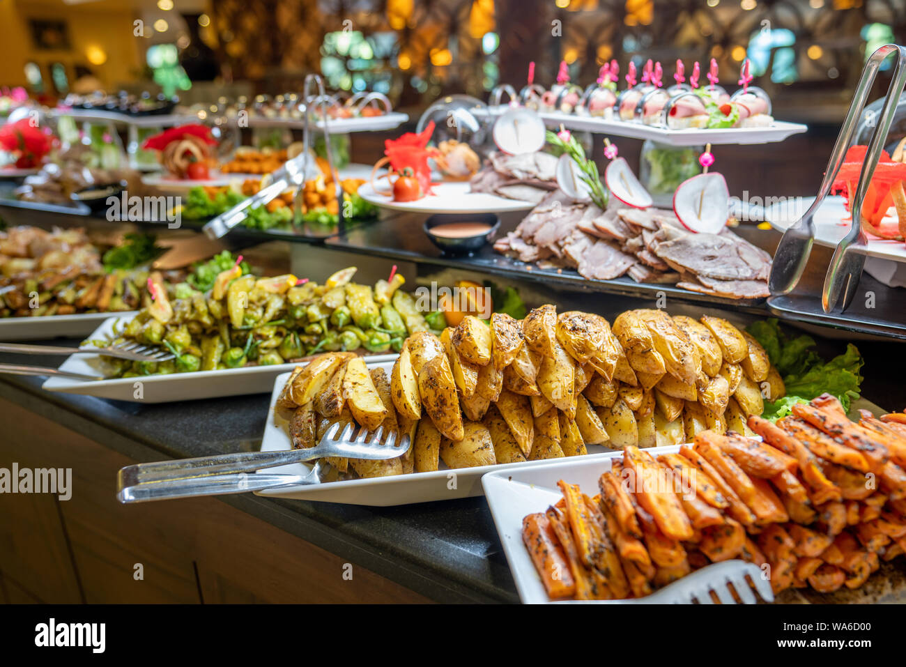 Close up of foods with plates in buffet of restaurant Stock Photo Alamy