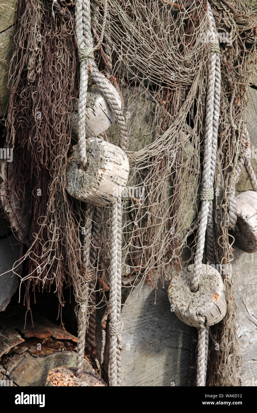 old fishing nets with cork floats attached Stock Photo - Alamy