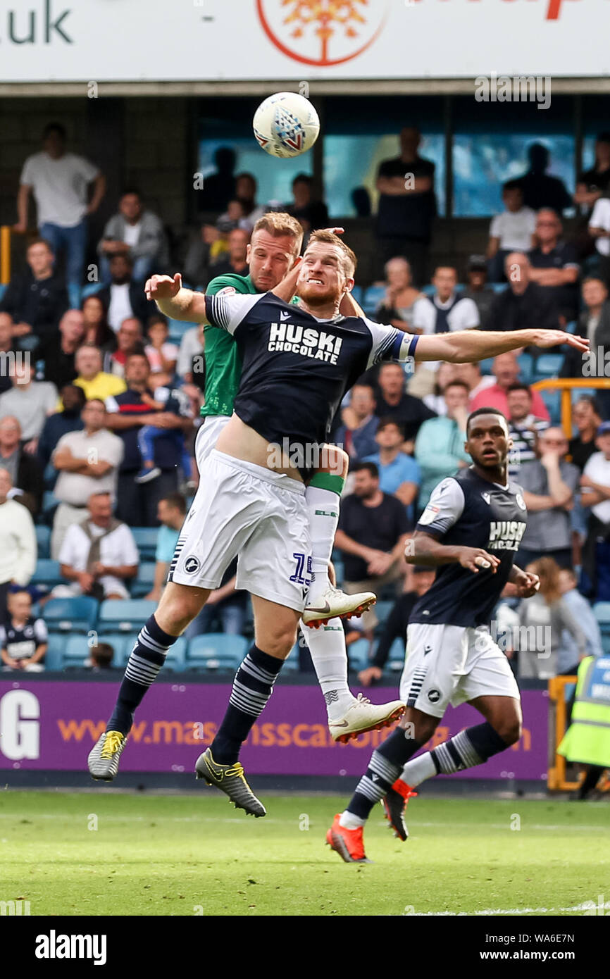 Alex Pearce of Millwall and Tom Lees of Sheffield Wednesday challenge for a header during the EFL Sky Bet Championship match between Millwall and Sheffield Wednesday at The Den, London, England on 17 August 2019. Photo by Ken Sparks.  Editorial use only, license required for commercial use. No use in betting, games or a single club/league/player publications. Stock Photo