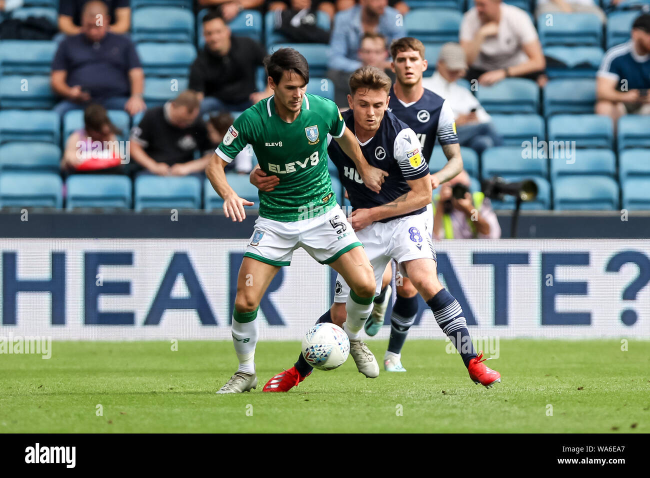 Kieran Lee of Sheffield Wednesday is challenged by Ben Thompson of Millwall during the EFL Sky Bet Championship match between Millwall and Sheffield Wednesday at The Den, London, England on 17 August 2019. Photo by Ken Sparks.  Editorial use only, license required for commercial use. No use in betting, games or a single club/league/player publications. Stock Photo