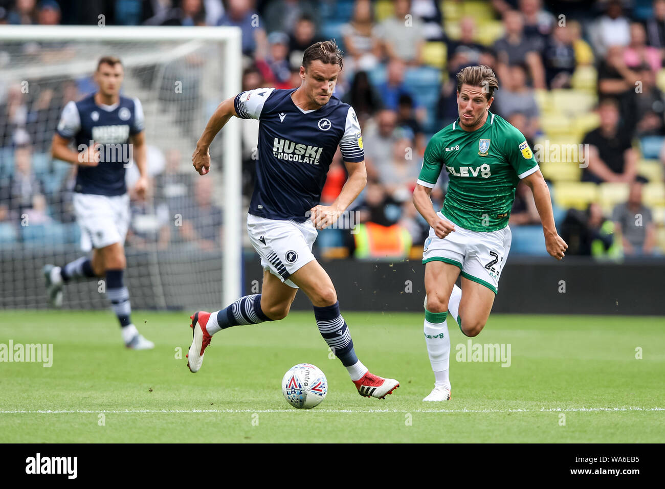 Matt Smith of Millwall is challenged by Sam Hutchinson of Sheffield Wednesday during the EFL Sky Bet Championship match between Millwall and Sheffield Wednesday at The Den, London, England on 17 August 2019. Photo by Ken Sparks.  Editorial use only, license required for commercial use. No use in betting, games or a single club/league/player publications. Stock Photo
