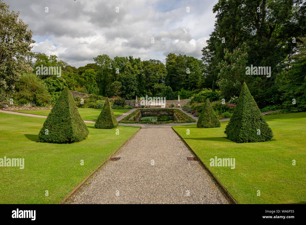 Menai Bridge, Wales, UK - Aug 15, 2019: Far view of the central perspective of the formal garden of the Plas Cadnant Estate Stock Photo
