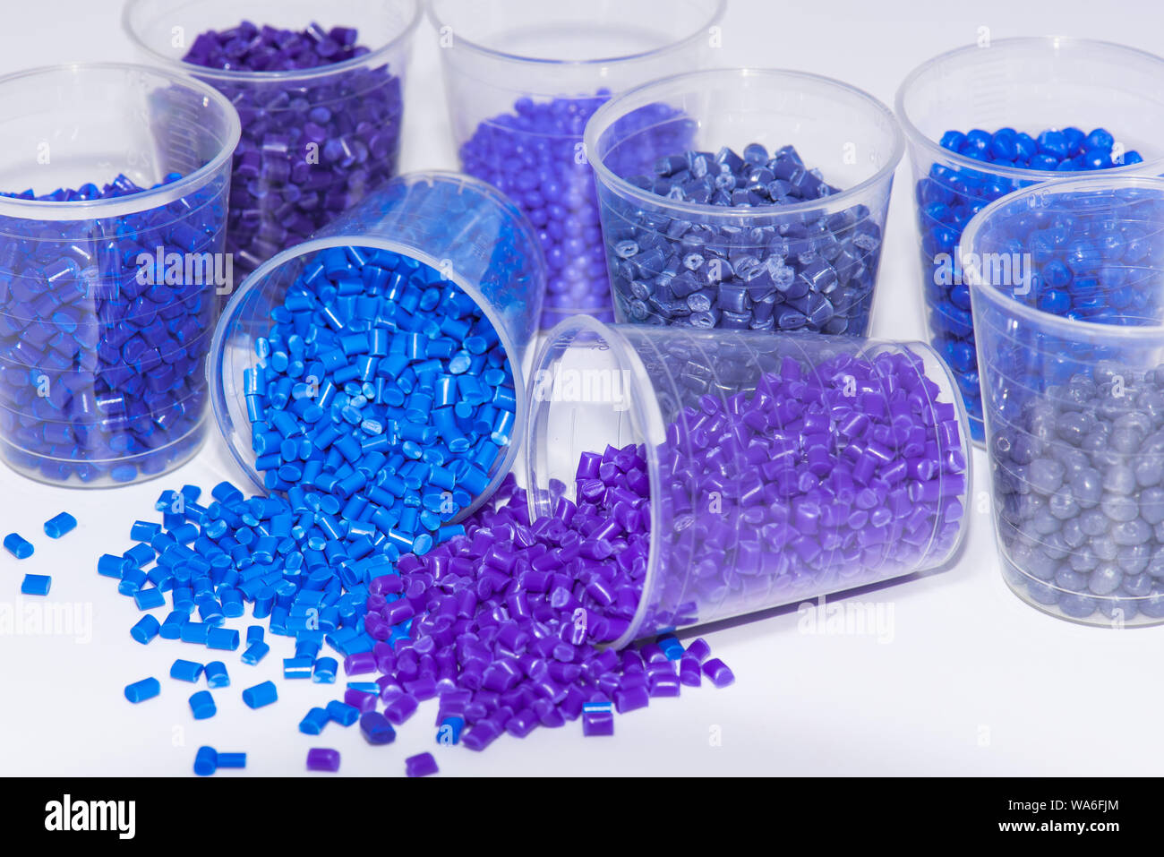 some blue and violet dyed thermoplastic resin on white background Stock Photo