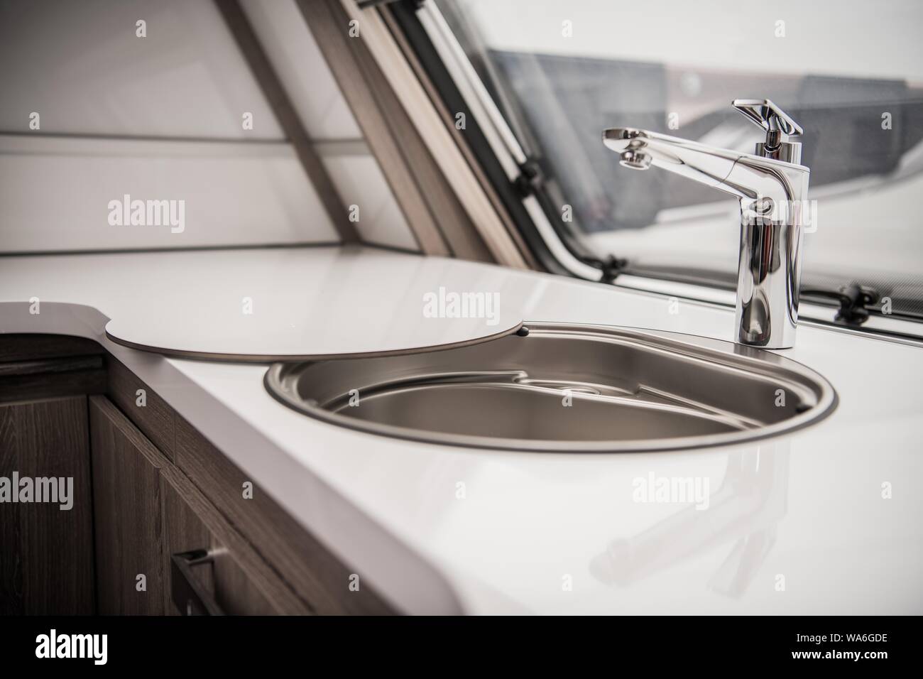 Circular RV Camper Sink and Faucet. Elegant Recreation Vehicle Interior. Stock Photo