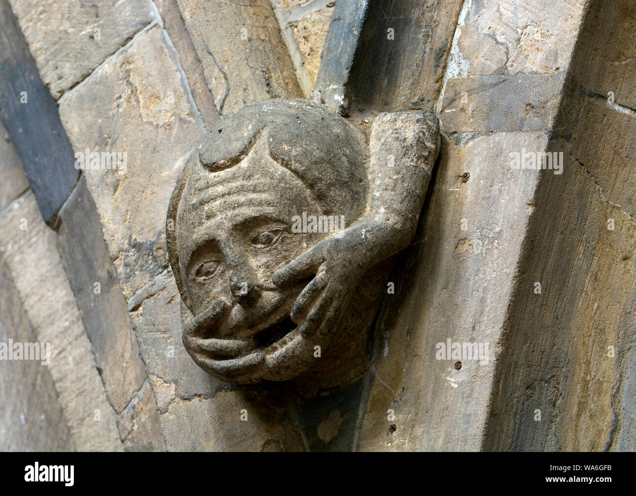 A carved corbel head in All Saints Church, Middleton Cheney, Northamptonshire, England, UK Stock Photo
