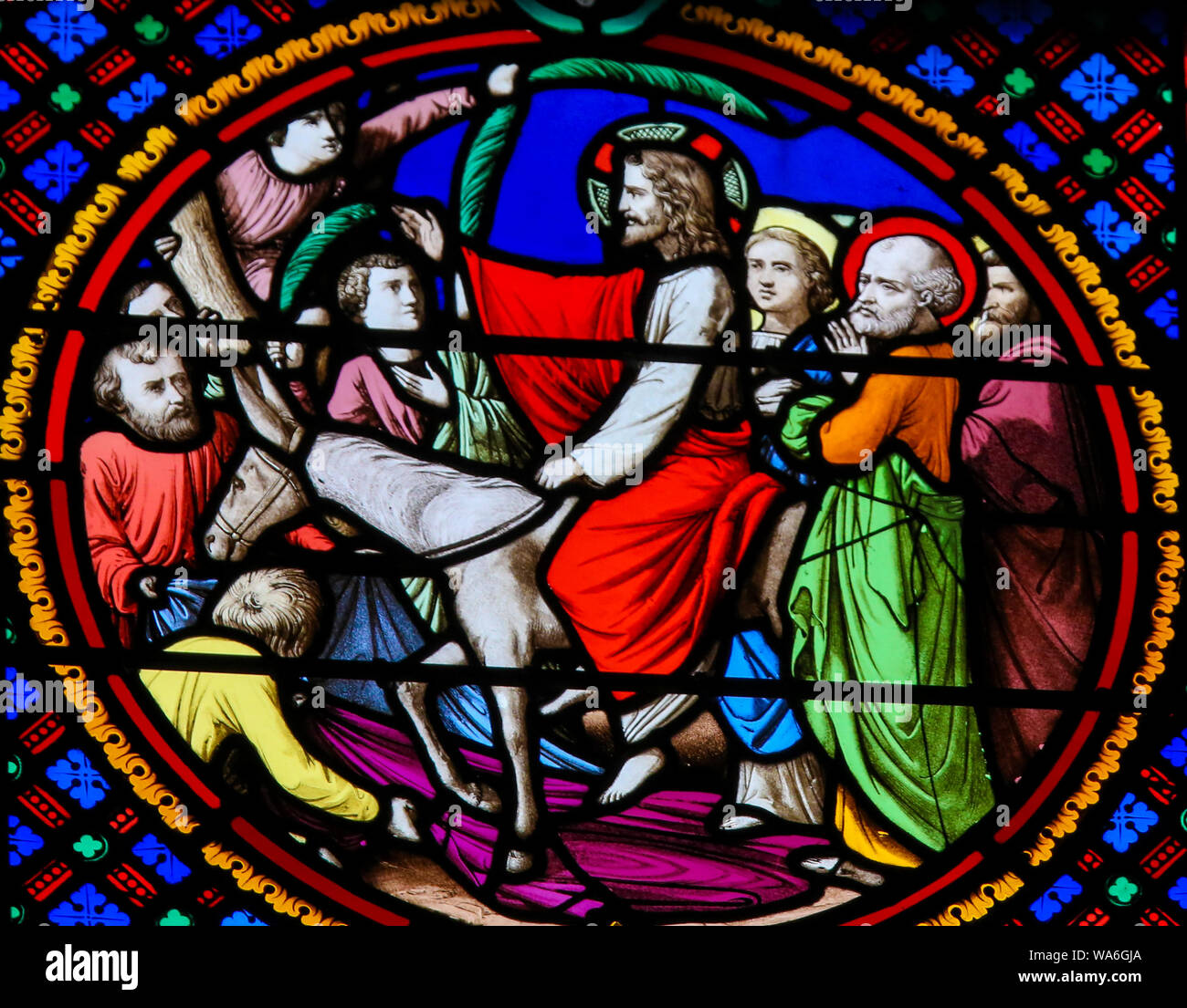 Stained Glass in the Chapel of Notre-Dame-des-flots (1857) in Sainte Adresse, Le Havre, France, depicting Jesus entering Jerusalem on Palm Sunay Stock Photo