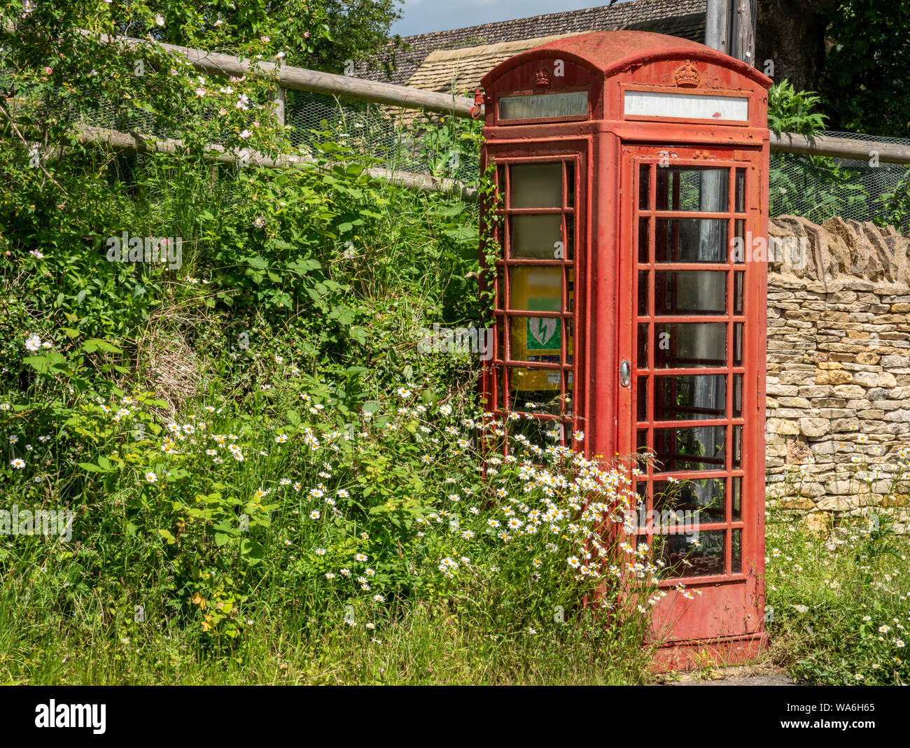 Old traditional British telephone box in Naunton, The Cotswolds, United Kingdom Stock Photo
